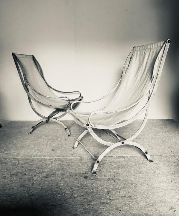 Paire de fauteuils transat en fer forge et toile . France circa 1970